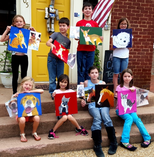 Kids with their pet paintings and reference photos